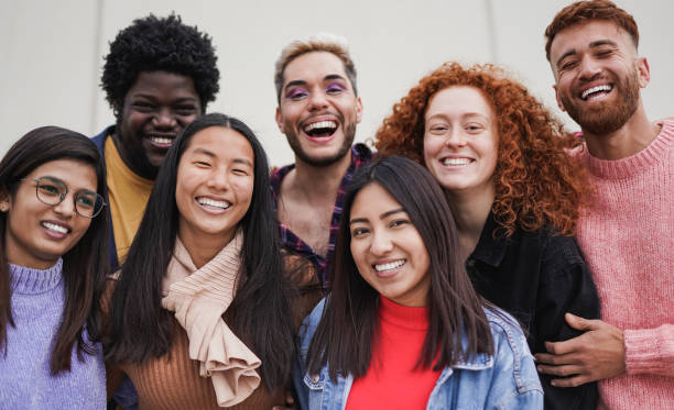 istock Group of multiethnic young people having fun outdoor while smiling on camera - Focus on the asian girl face 1425571267
