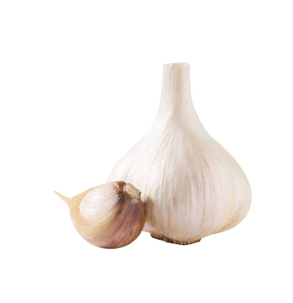 istock garlic cloves and bulbs isolated on white background. 1425571606