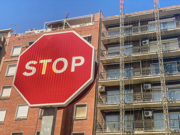 istock Stop sign in front of buildings 1425572736