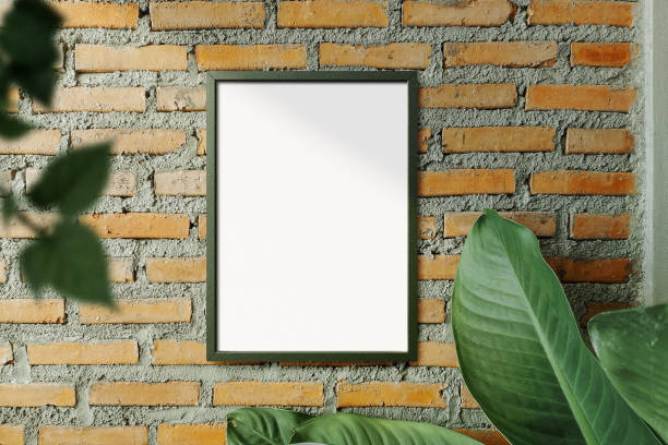 istock Clean minimal frame mockup on the brick mon wall with leaves 1425573944