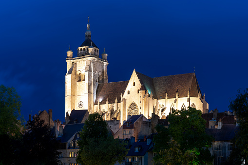 Dole, France - 14 September, 2022: view of the illuminated Notre Dame catholic church in the city center of Dole  at night