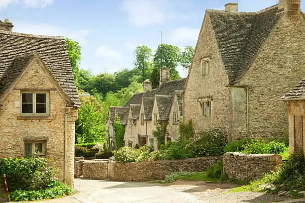Traditional Cotswold cottages in England, UK.  spring. Bibury is a village and civil parish in Gloucestershire, England.