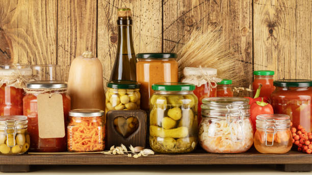 istock Fermented vegetables and mushrooms in jars and cider placed in row 1425579400