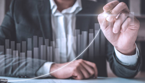 istock Business people working with modern computer on virtual screen analyzing, finance sales data and economic growth graph chart, Business financial and stock graph, stock marketing analysis. 1425579569