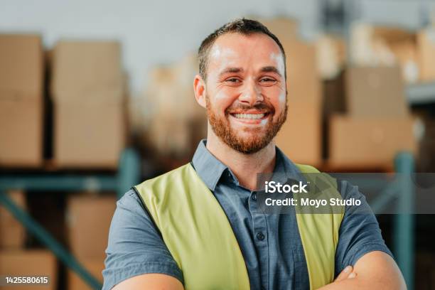 Factory Or Warehouse Worker In Shipping Plant Happy And Smiling About New Import And Export Cargo Portrait Of A Young Logistics Or Supply Chain Industry Manager Looking Excited And Proud Stock Photo - Download Image Now