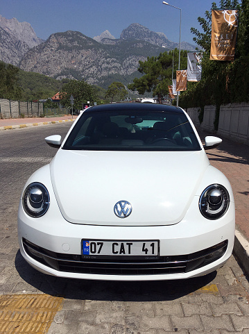 Antalya, Turkey 10.08.2022:New white 2022 Volkswagen Beetle 2023 parked in the city.