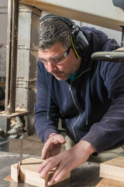 istock Male carpenter working in his carpentry workshop. 1425581796