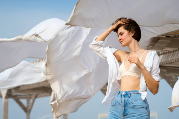 istock Caucasian girl on beach windy day 1425581879
