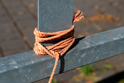 Knotted rope as teamwork. Photo is taken on studio in 16 bit color depth with medium format camera