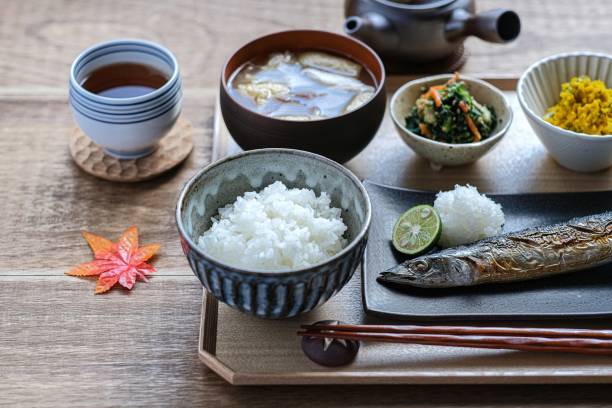 Autumn table with salt-grilled saury Saury, a seasonal fish in autumn.It is indispensable for the Japanese autumn dining table.In addition, mushroom miso soup and pumpkin salad. washoku stock pictures, royalty-free photos & images