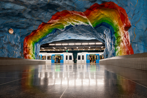 Sweden Stockholm, March 07, 2021, Underground transport metro station in the city center Stadion with beautiful walls and a rainbow