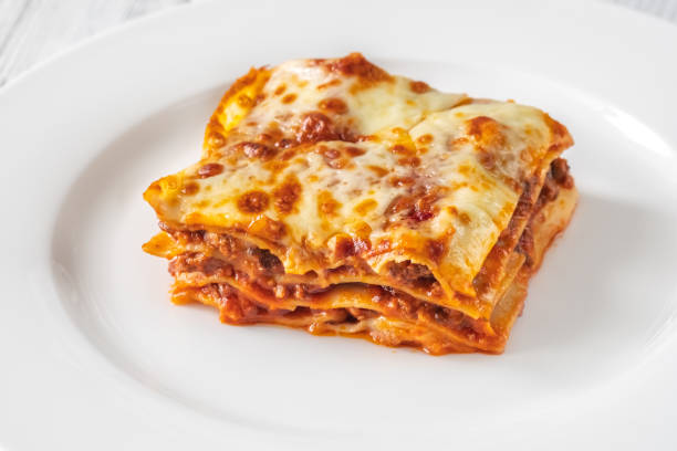 istock Portion of lasagne on white plate 1425596270