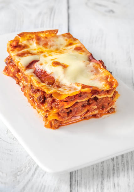 istock Portion of lasagne on white plate 1425596364