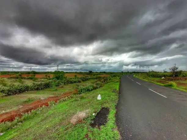 Road during monsoon season. Natural landscape with cloud