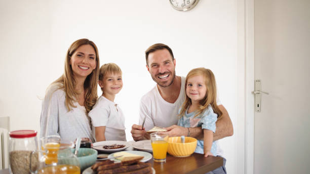 istock Parents with their kids in dining room having breakfast together 1425601898