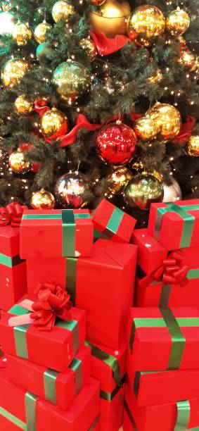 istock red boxes with gifts under the christmas tree 1425602239