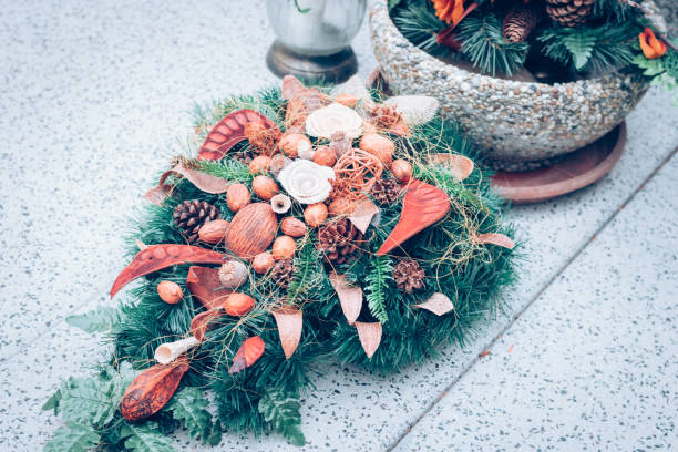 istock floral decoration and candles on the grave 1425606744