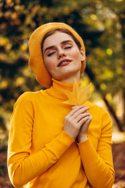 istock Beautiful woman enjoying autumn 1425606917