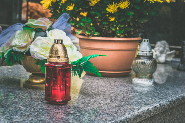 istock candles in lantern on the grave 1425607035
