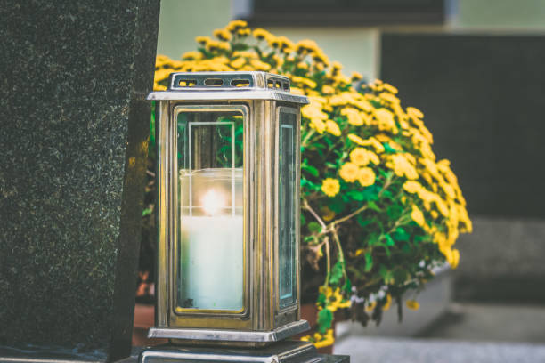 istock candles in lantern on the grave 1425607243
