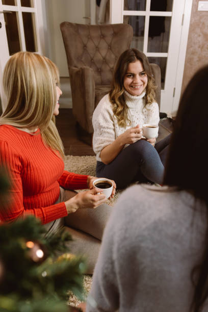 istock Friends celebrating Christmas at home 1425609117