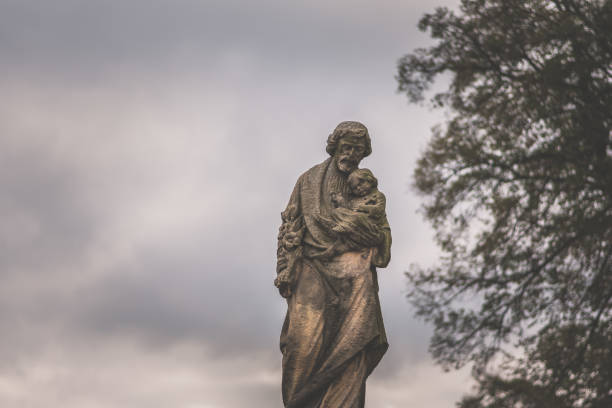 istock religious statues in the cemetery 1425609406
