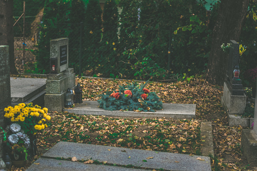 colorful decoration and burning candles in the cemetery