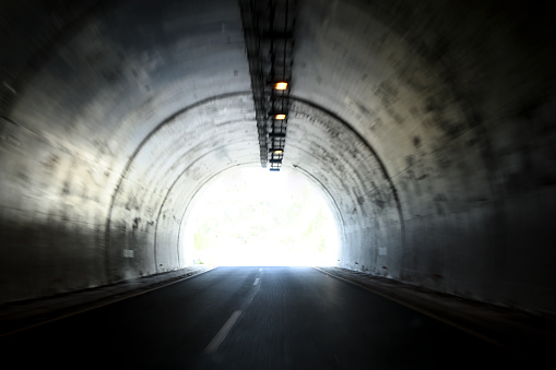 Navigating through a dark tunnel: POV car driver in challenging conditions in Virginia.