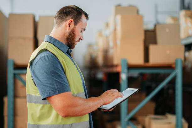 istock Logistics worker planning on tablet online, doing check on cargo shipment and doing inventory list on technology working at a distribution warehouse. Industrial engineer shipping delivery at factory 1425618125