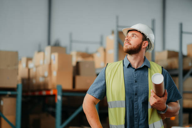 istock Logistics worker, employee and man thinking of creative construction job at distribution warehouse, planning shipping strategy and maintenance at storage factory. Builder working at industrial plant 1425618156