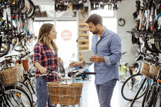 istock Customer and dealer in bicycle shop 1425618921