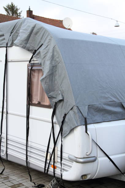 istock a caravan with a gray tarpaulin 1425620160