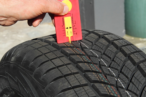 with new winter tires, the profile is measured with a tread depth gauge