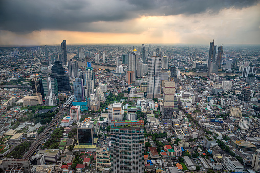 Aerial view modern office buildings in Bangkok city downtown with sunset time, Bangkok, Thailand