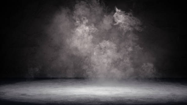 istock Smoke over rough grainy stone floor in the dark. Halloween texture background 1425625311