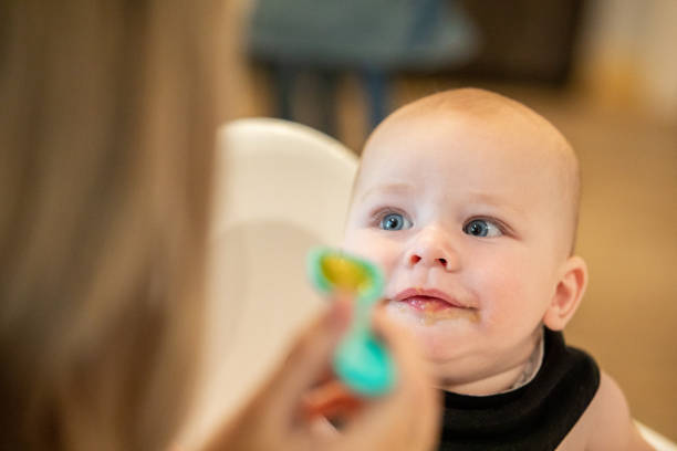 istock Beautiful baby boy looking at his mother. 1425625416