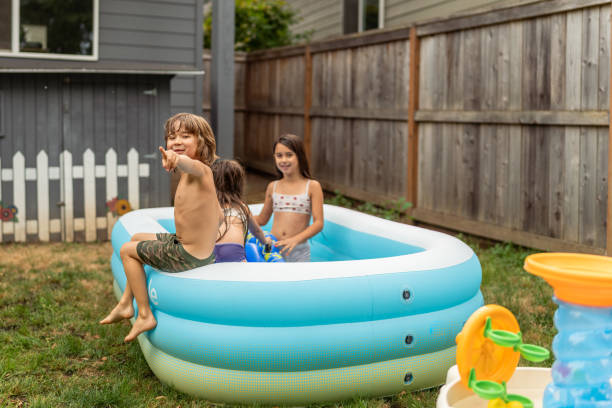 istock Ethnic Siblings Playing And Splashing In The Pool! 1425633977