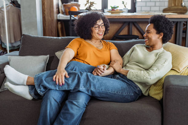 istock Lesbian couple lying on the couch 1425634270
