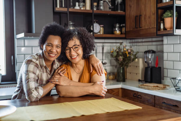 istock Two mid aged women in the kitchen 1425635690