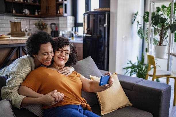 istock Homosexual couple embracing and taking a selfie 1425637022