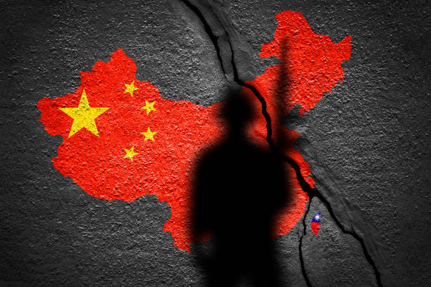 istock China and Taiwan flag map painted on a concrete wall with soldier shadow 1425637116