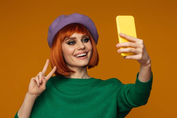 istock Beautiful emotional woman using smart phone 1425637748