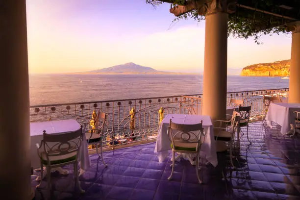 Restaurant with views to the sea and Vesuvius volcano. Sorrento, Italy.