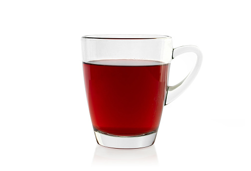 A freshly made cup of fruit tea, studio shot isolated against a white background. Photo contains a clipping path