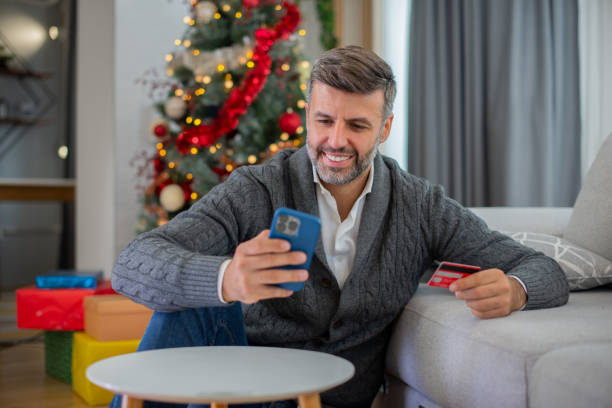 istock Man celebrating Christmas Eve at home 1425641851