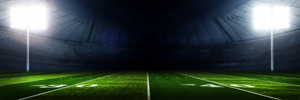 American football stadium background American football stadium with lights at night american football field stock pictures, royalty-free photos & images