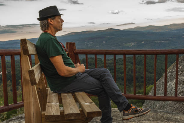 istock man contemplating the landscape 1425642758