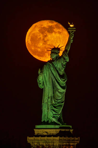 istock Moonrise Behind Statue of Liberty 1425649107