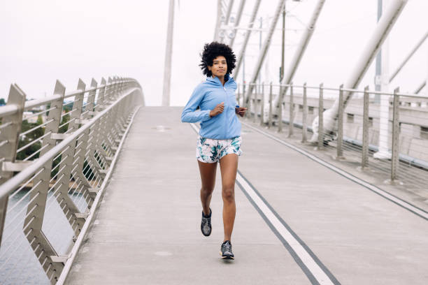 istock Woman Enjoying Run on Urban Bridge 1425649310