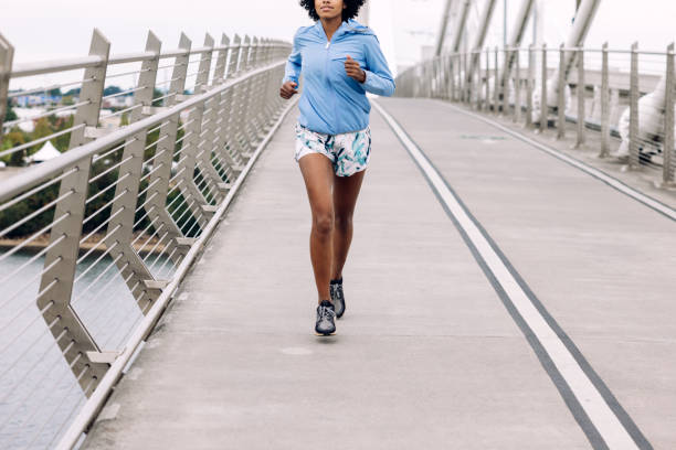 istock Woman Enjoying Run on Urban Bridge 1425649313